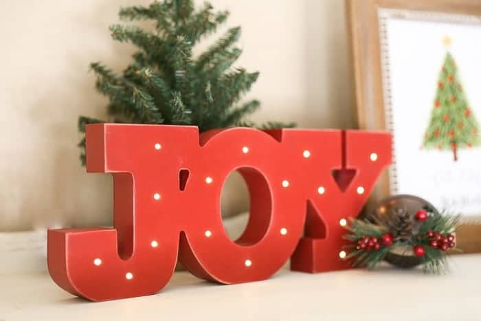 Add farmhouse charm with this DIY galvanized bucket to hold your Christmas tree.