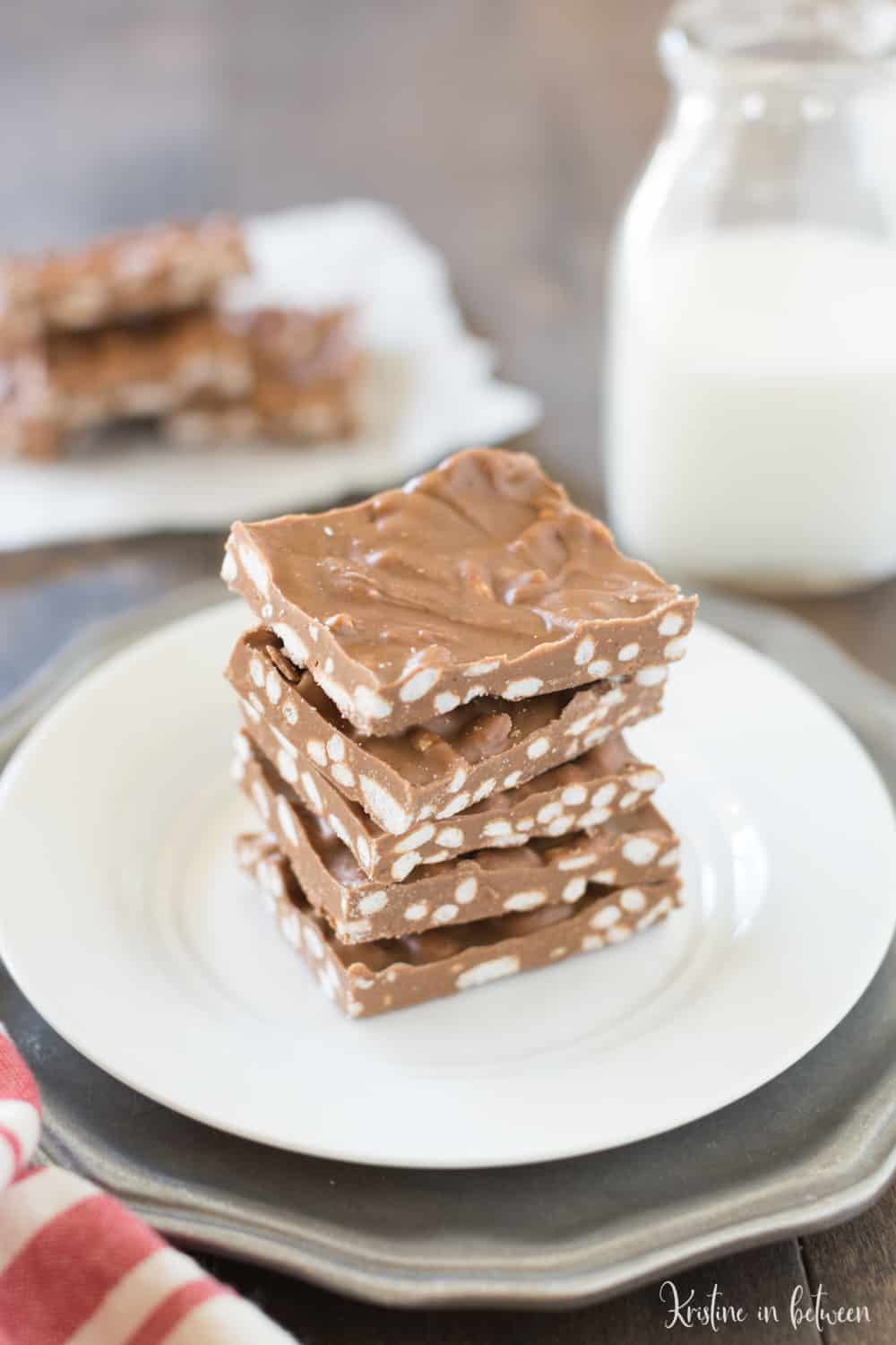 Simple three ingredient peanut butter chocolate crunch bars! These bars are low in sugar and high in protein.