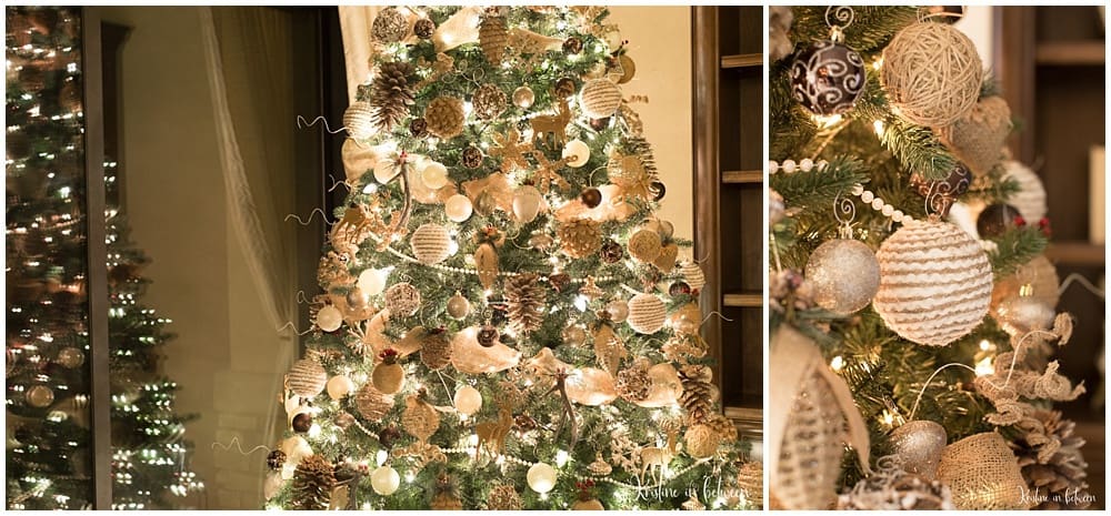 A decorated and lit Christmas tree with neutral colored ornaments.