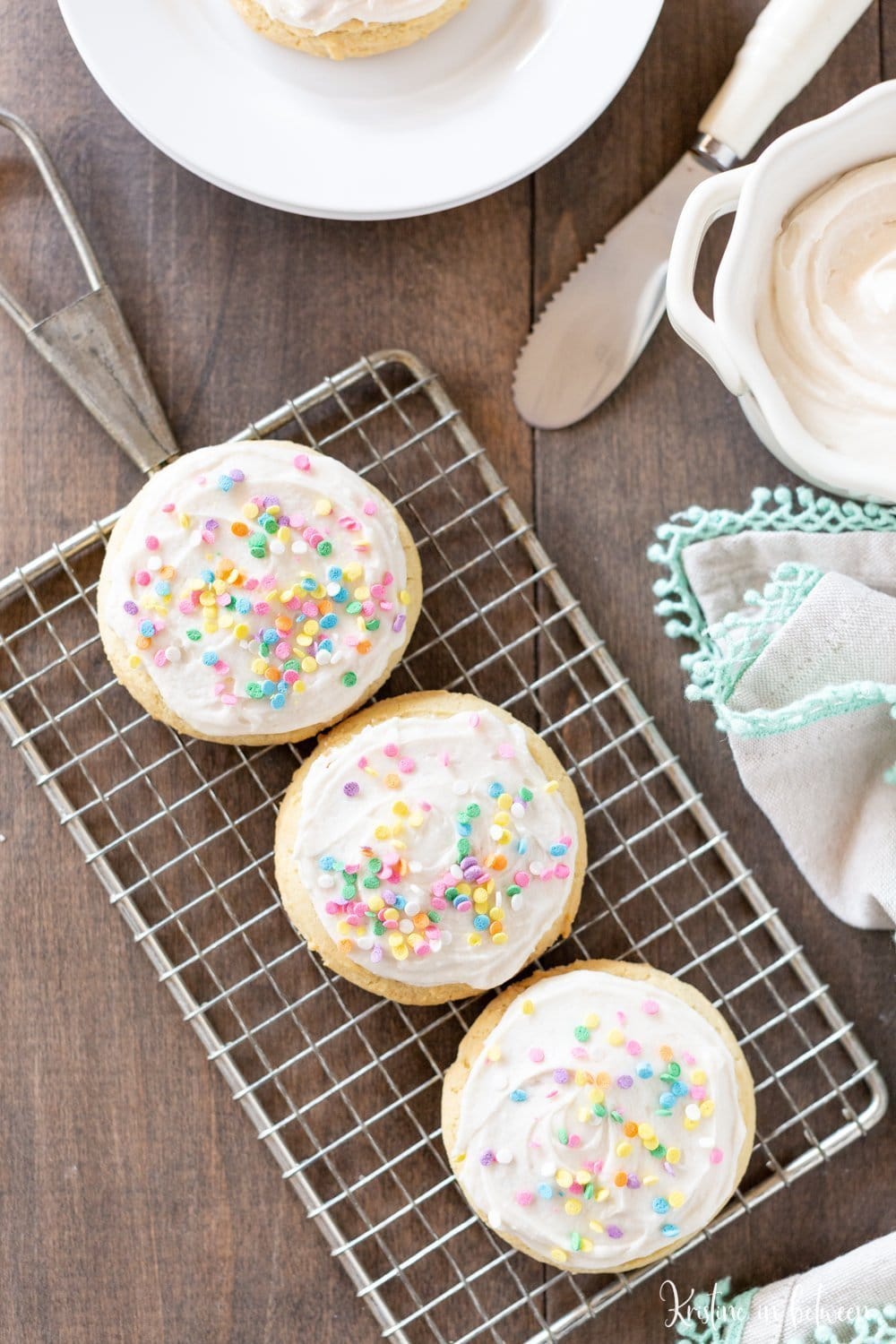 This soft sugar cookie recipe is a must-bake for the holidays! The cookies are light and fluffy, making them perfect for buttercream frosting and sprinkles!