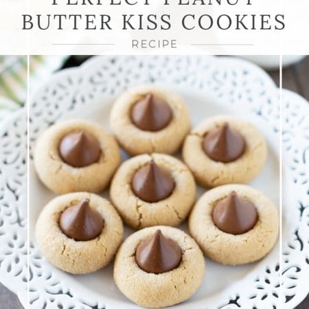 Peanut butter kiss cookies with a green striped napkin in the background