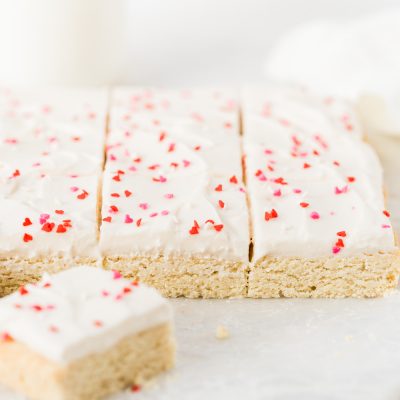 Super easy small batch sugar cookie bars with cream cheese frosting!