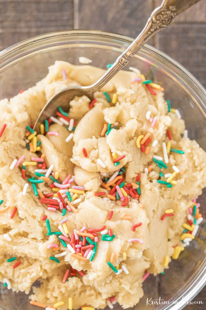 A bowl of cookie dough with sprinkles.