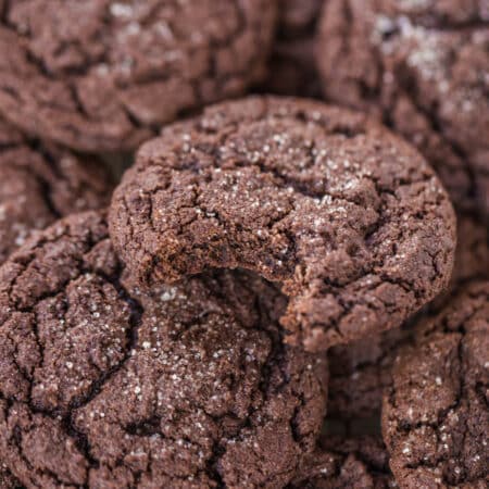 Cookies stacked up with a bite out of the top cookie.