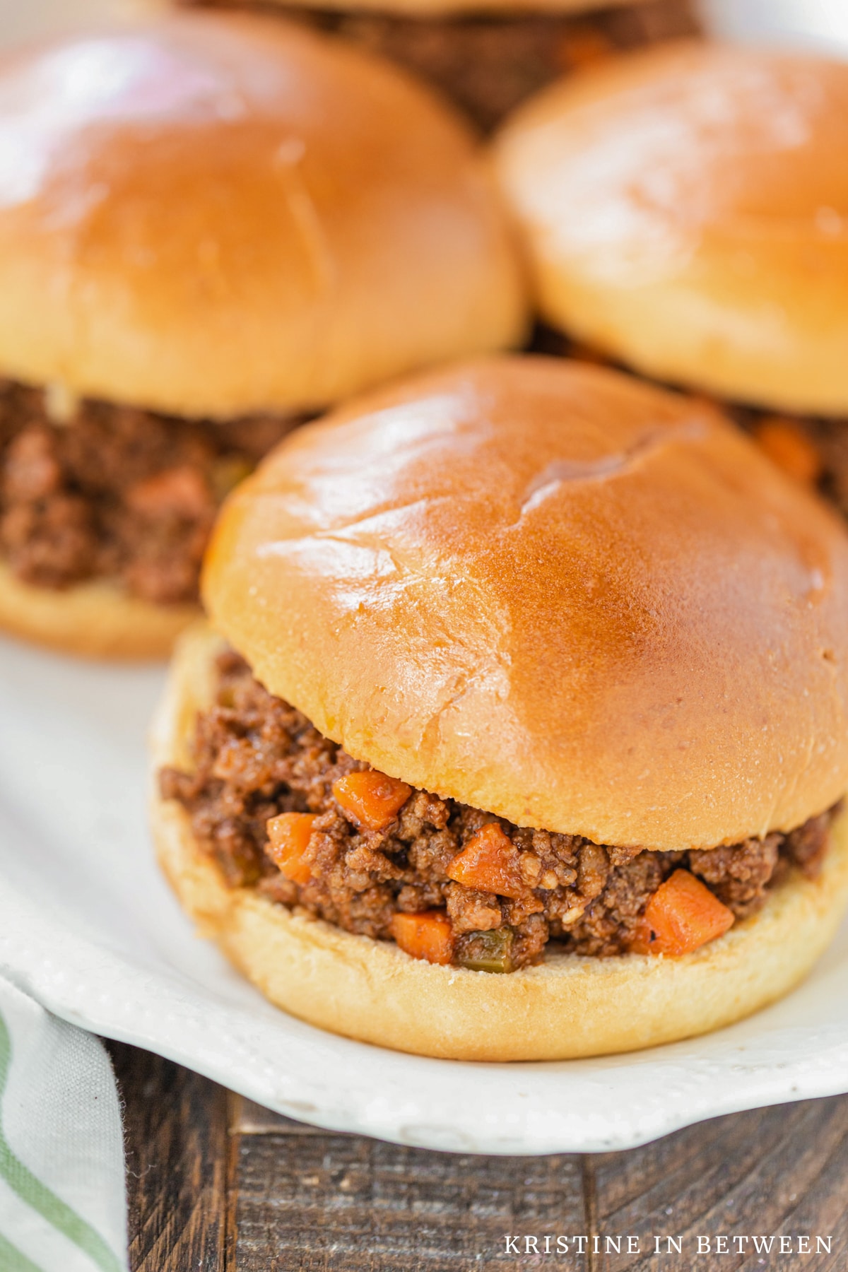 Several Sloppy Joes sitting on a platter.