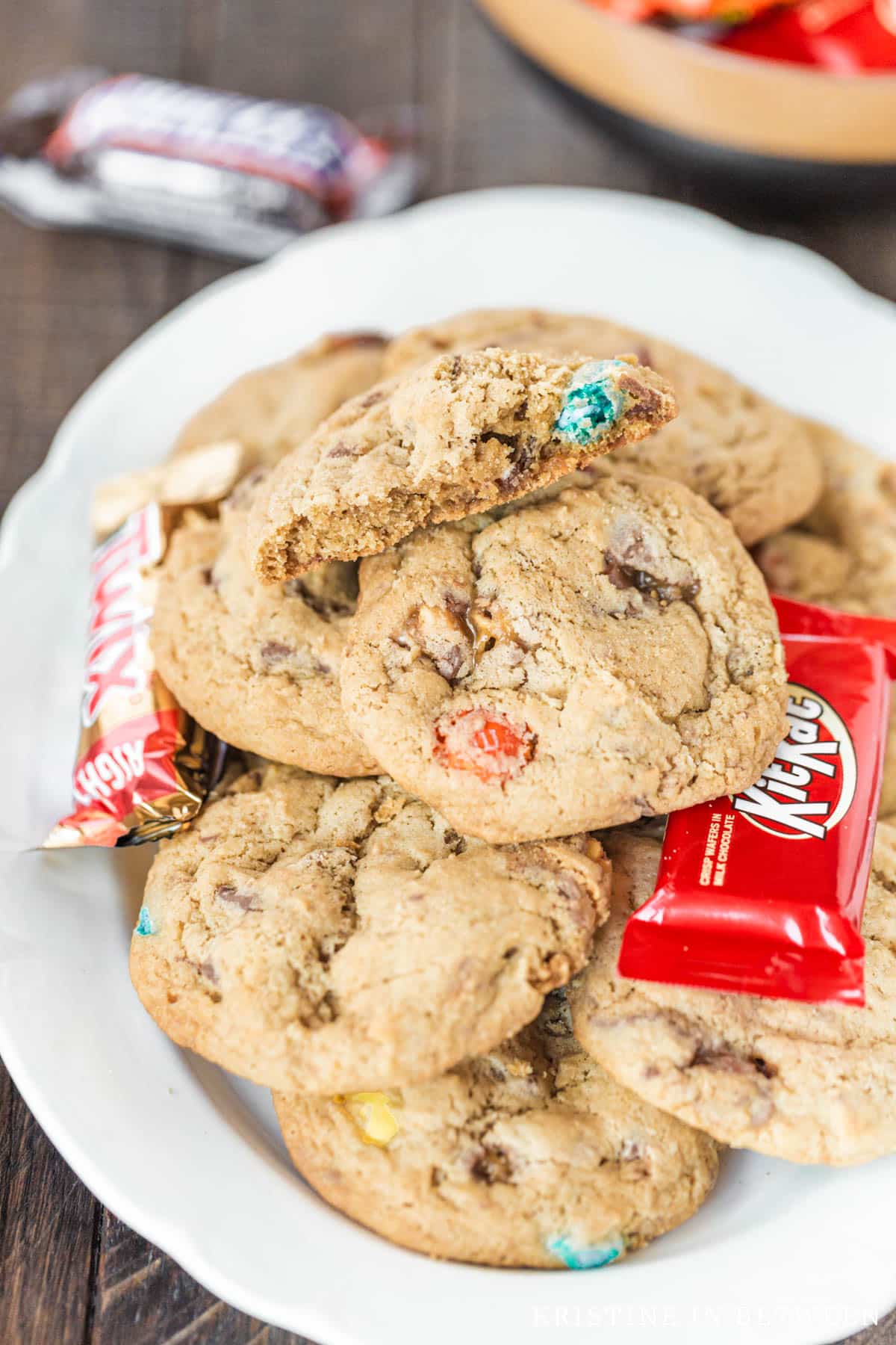 Cookies stacked on a platter with candy nestled with them.