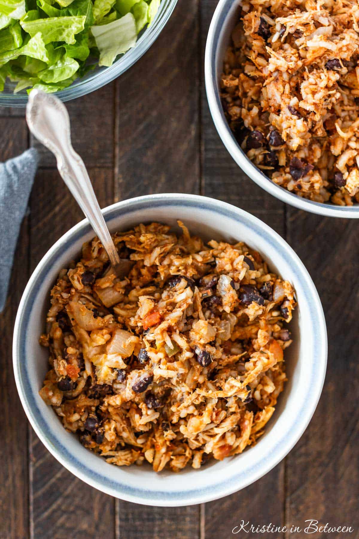 A bowl of taco chicken rice casserole with a fork in it.